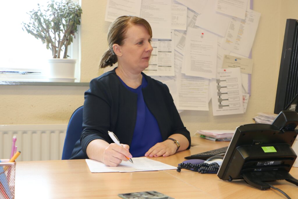 Sharon Mckie at desk