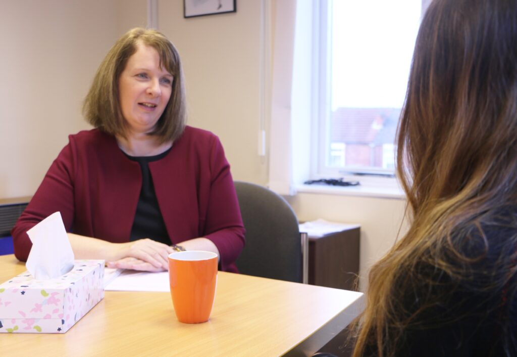 Sharon Mckie with a client